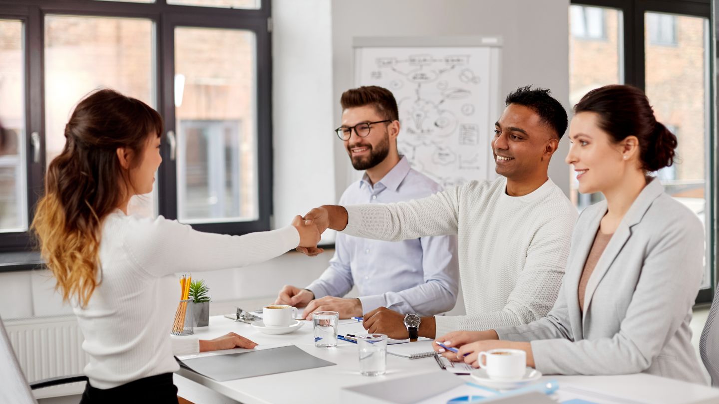 A Job Candidate Shaking Hands With Interviewers