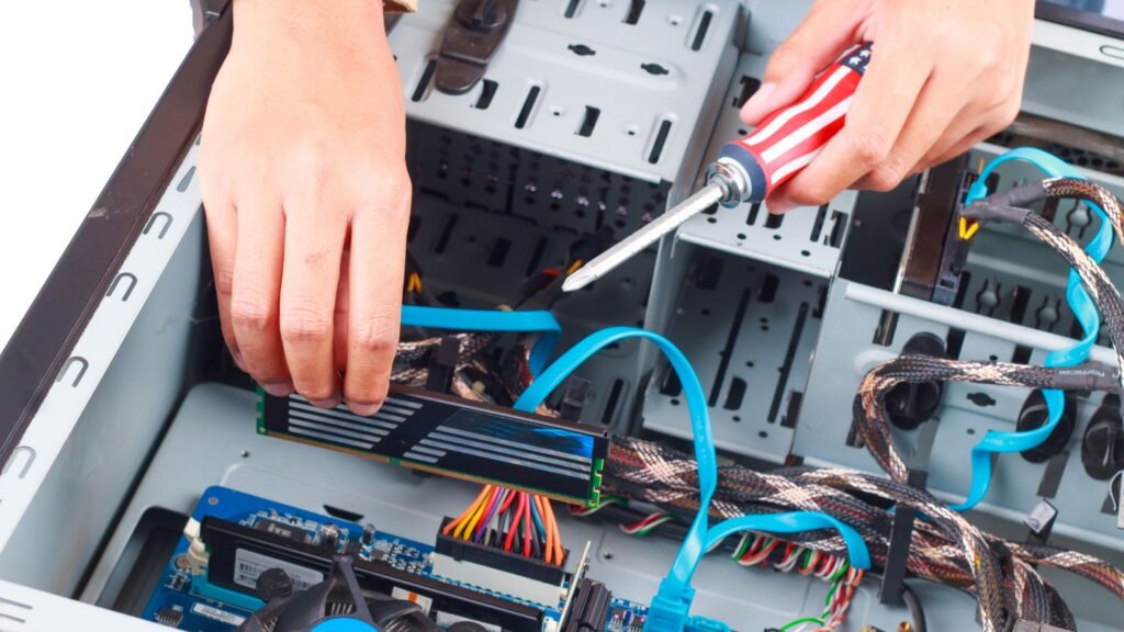 Technician Fixing Computer Unit