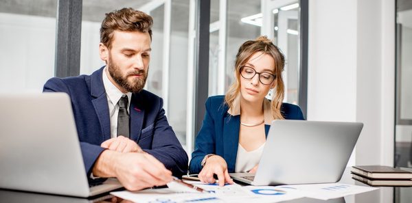 Professionals Reviewing Documents at a Desk